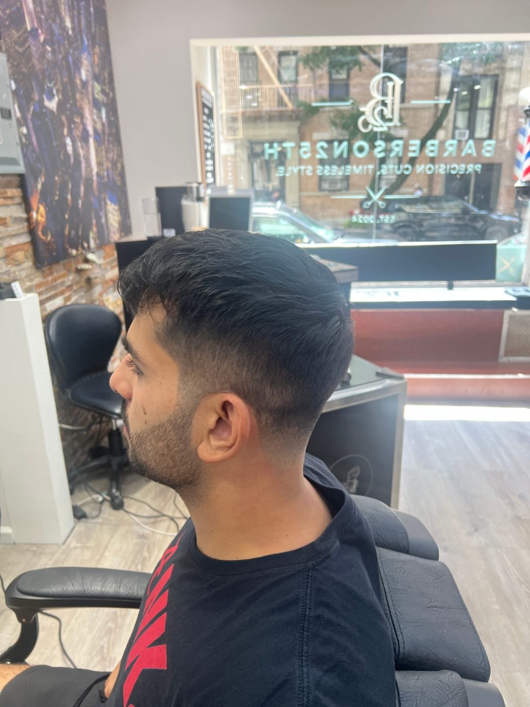Skin fade haircut by Barbers on 25th
