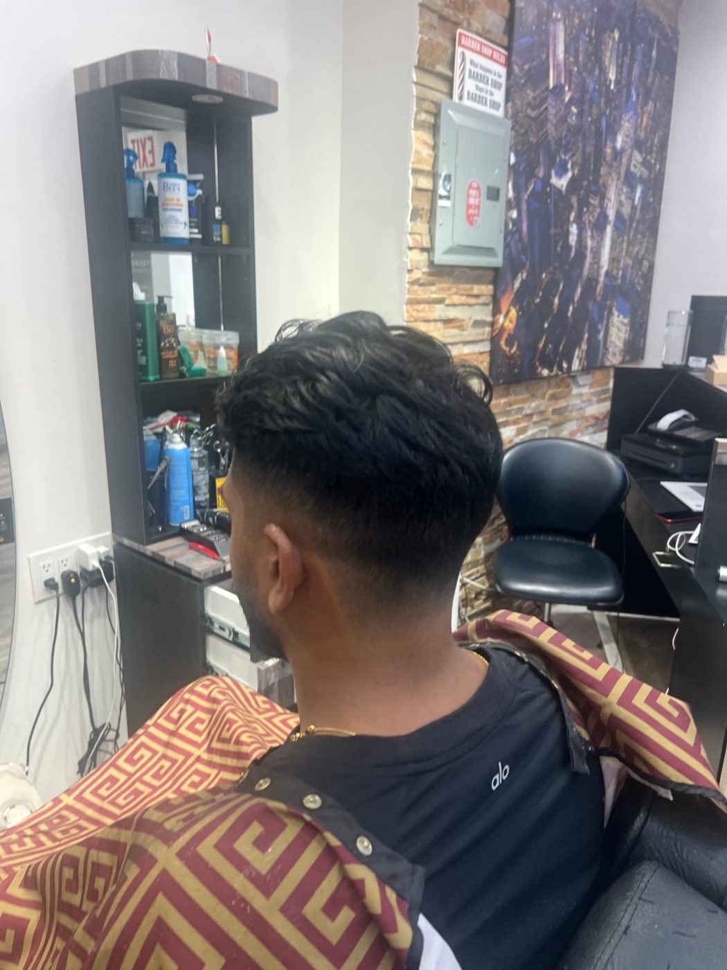 Textured fade haircut by Barbers on 25th