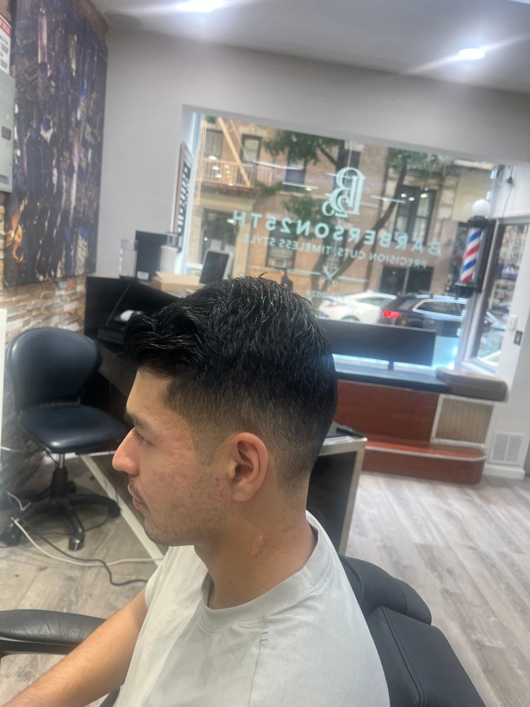 Taper fade haircut by Barbers on 25th